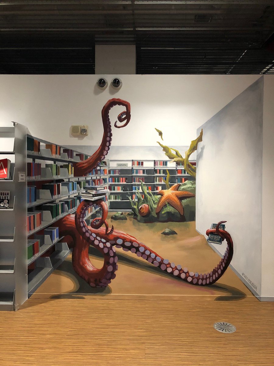 SPLBuzz's tweet photo. Can you find our new #instastop mural at the Central Library? This #trompeloeil artwork was created by Urban Artworks artist Will Schlough. Share your #SPLselfie, and look for more hidden murals at the Central Library soon! https://t.co/Brd8zCX4Qr