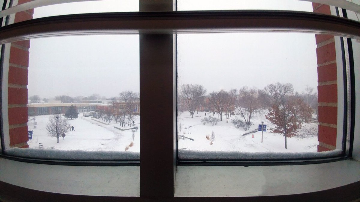 KruegerLibrary's tweet photo. It's not every day you can be in a library snow globe! Find a cozy spot in the library and enjoy the view. #LibrarySnowGlobe #WSUsnow #WinterWarriors https://t.co/h2VXraXXj5