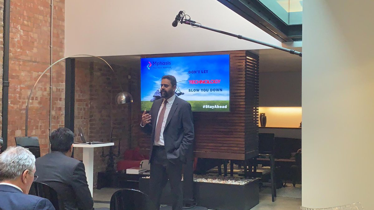 Mphasis's tweet photo. .@guru656 addresses the gathering on how Mphasis aims to power #innovation and #transformation in the UK. #MphasisInUK #StayAhead https://t.co/yKiwgKvFib