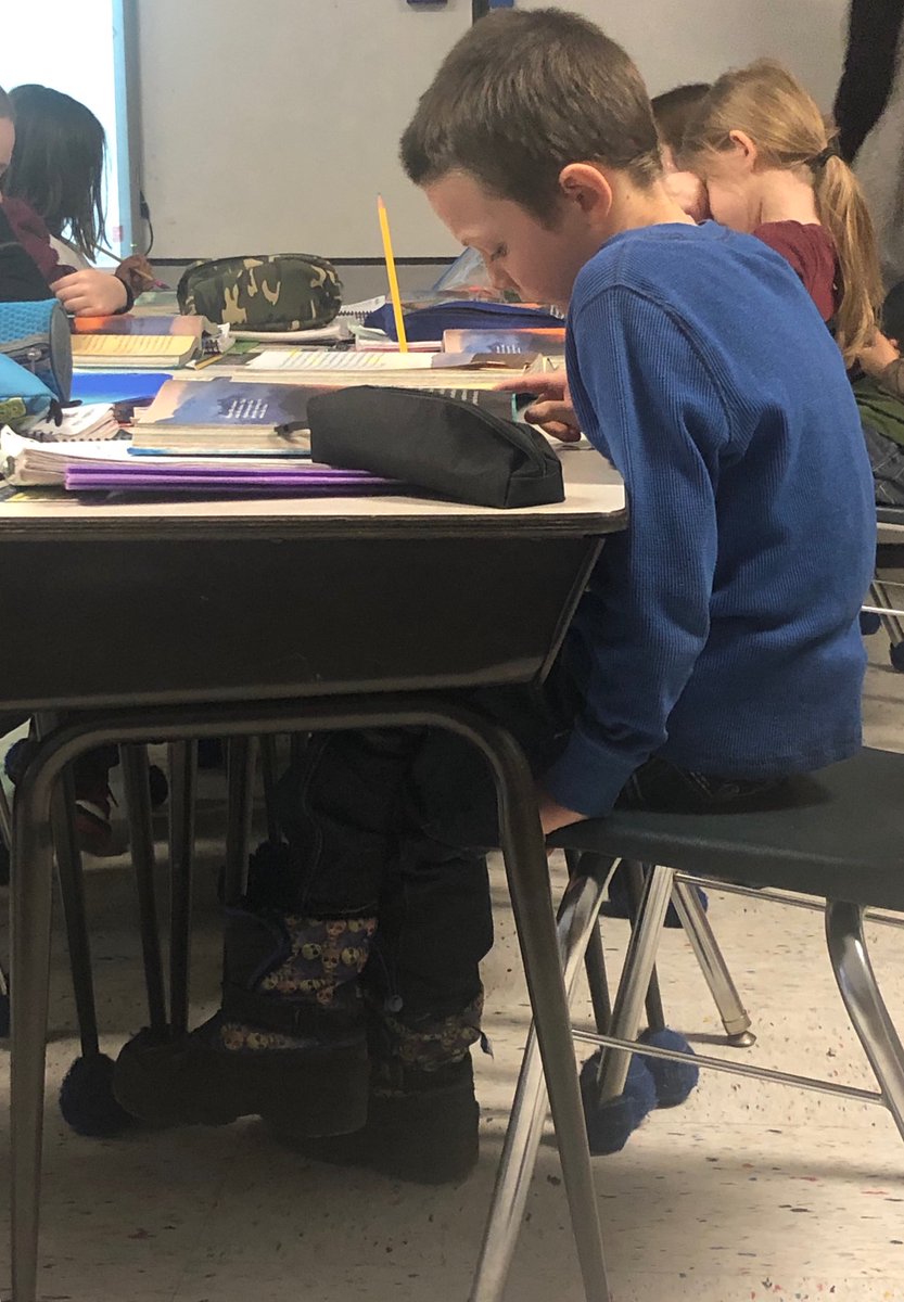 Megan_OS_Rose's tweet photo. This second grader is completely engaged in reading about volcanoes! 🌋
#SidneyES https://t.co/Etydqm2hHA
