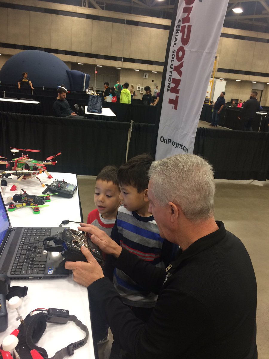 OnPoynt's tweet photo. The OnPoynt staff helps students learn to fly a drone simulator and find out about FPV drone racing while others learn to build a STEM@drone @disdstemscience STEM EXPO. #STEMeducation #STEMdrones #STEM https://t.co/uEaqsCrPl1