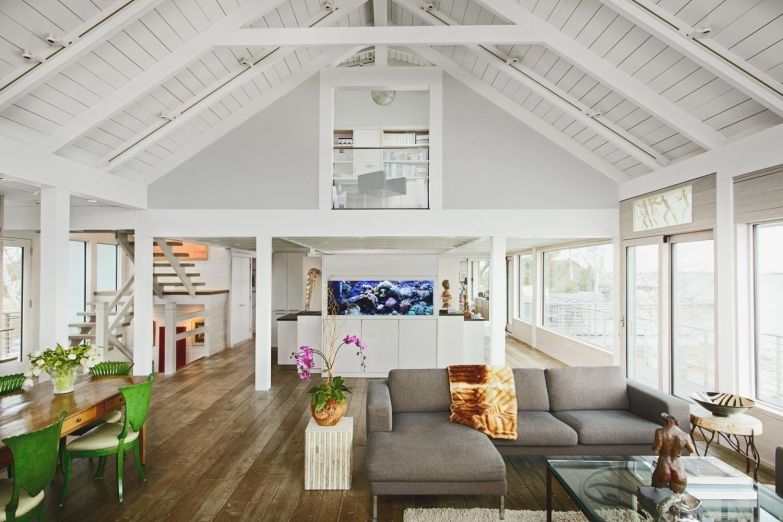 Gorgeous Open Living Room with High White Beams and Pillars by @TallmanSegerson Builders -See more here: buff.ly/2WJ0dtQ #OpenLivingRoom #HighWhiteBeams #LivingRoomPillars #HGDesignIdeas