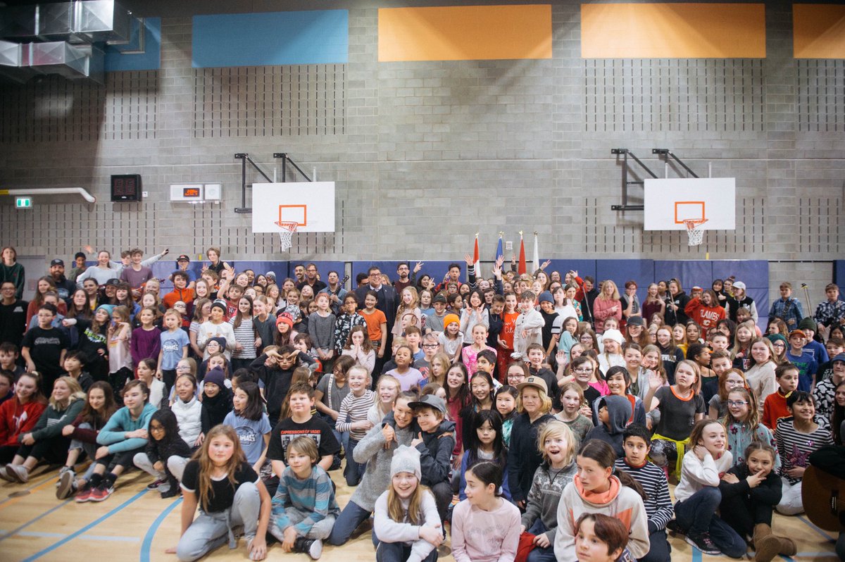 arkellsmusic's tweet photo. Pretty amazing day in Calgary. Snuck in to the @CalgaryArtsAcad as they performed their 200 person rendition of People’s⚡️Champ. Together with mayor @nenshi, our friends at @musicounts surprised the school with $5,000 worth of musical equipment. Arkellz is for the children. https://t.co/0uQgxhLk2A