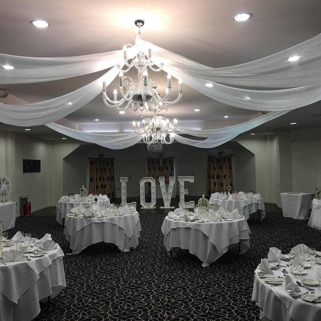 Big Bash Events ceiling draping also available with twinkling lights .