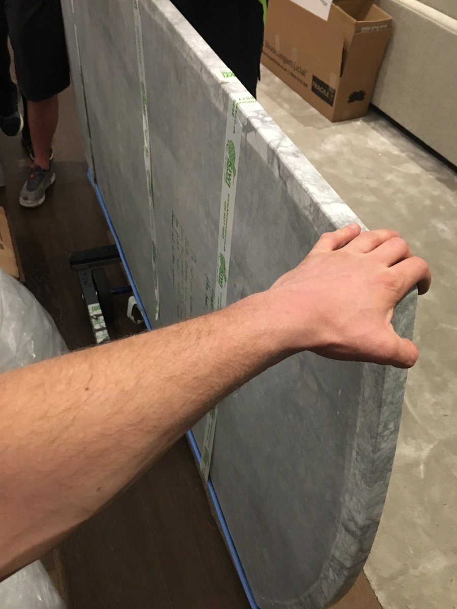 He ain't heavy, he's my job! Takes quite the #teamwork to move a big slab of expensive worktop like this. We have it all in hand though. Trust us with your next house move #housemove #London #shipping #international