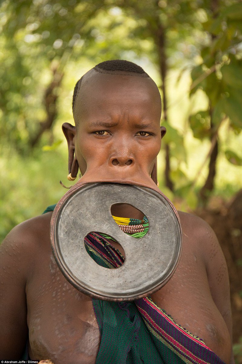 #18: Lip disksThe lip disk position purposely resembles certain birds which have a ritual significance. For some Africa tribes, lip disks are usually inserted around 6 months to a yr before a young girl is to marry. Conducted during an initiation ritual, disks symbolize beauty.