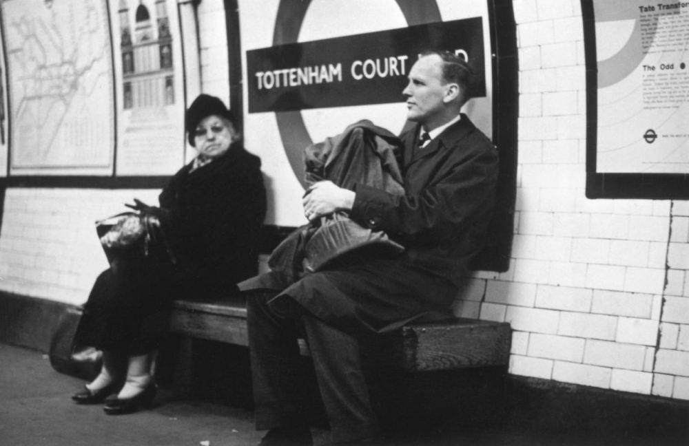 West Ham manager Ron Greenwood holds the FA Cup, won by his team the previous Saturday, as he waits for a train on the Underground in 1964