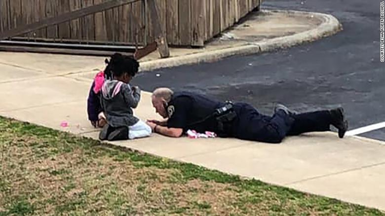 CNN's tweet photo. This Virginia police officer's motto: To protect and serve -- and then play dolls https://t.co/8vTzDSJEHw https://t.co/RzhqUunq5G