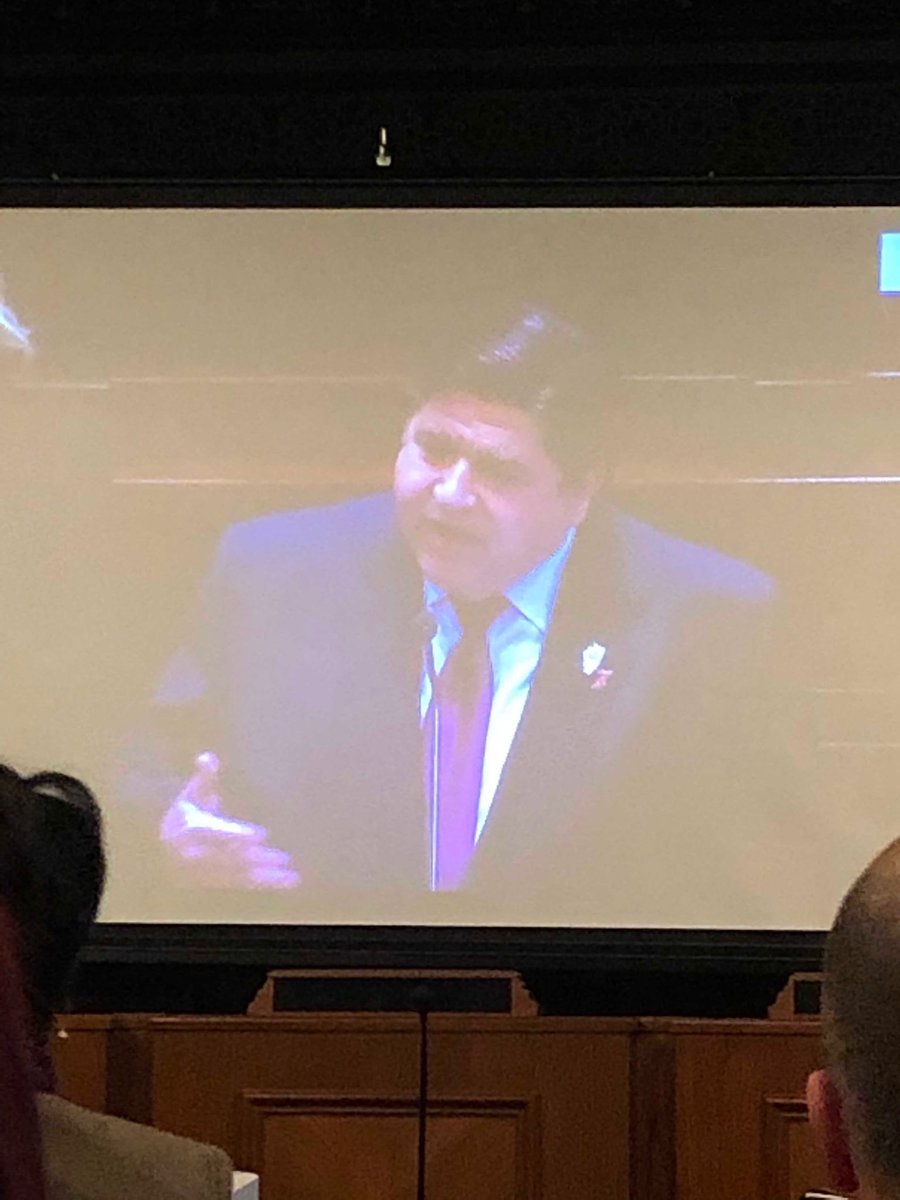 braun_lynne's tweet photo. Can’t see this well but @GovPritzker is wearing a #RedDressPin while delivering his budget address @AHAIllinois @avolgman #GoRedIL https://t.co/DWBEFj56xQ