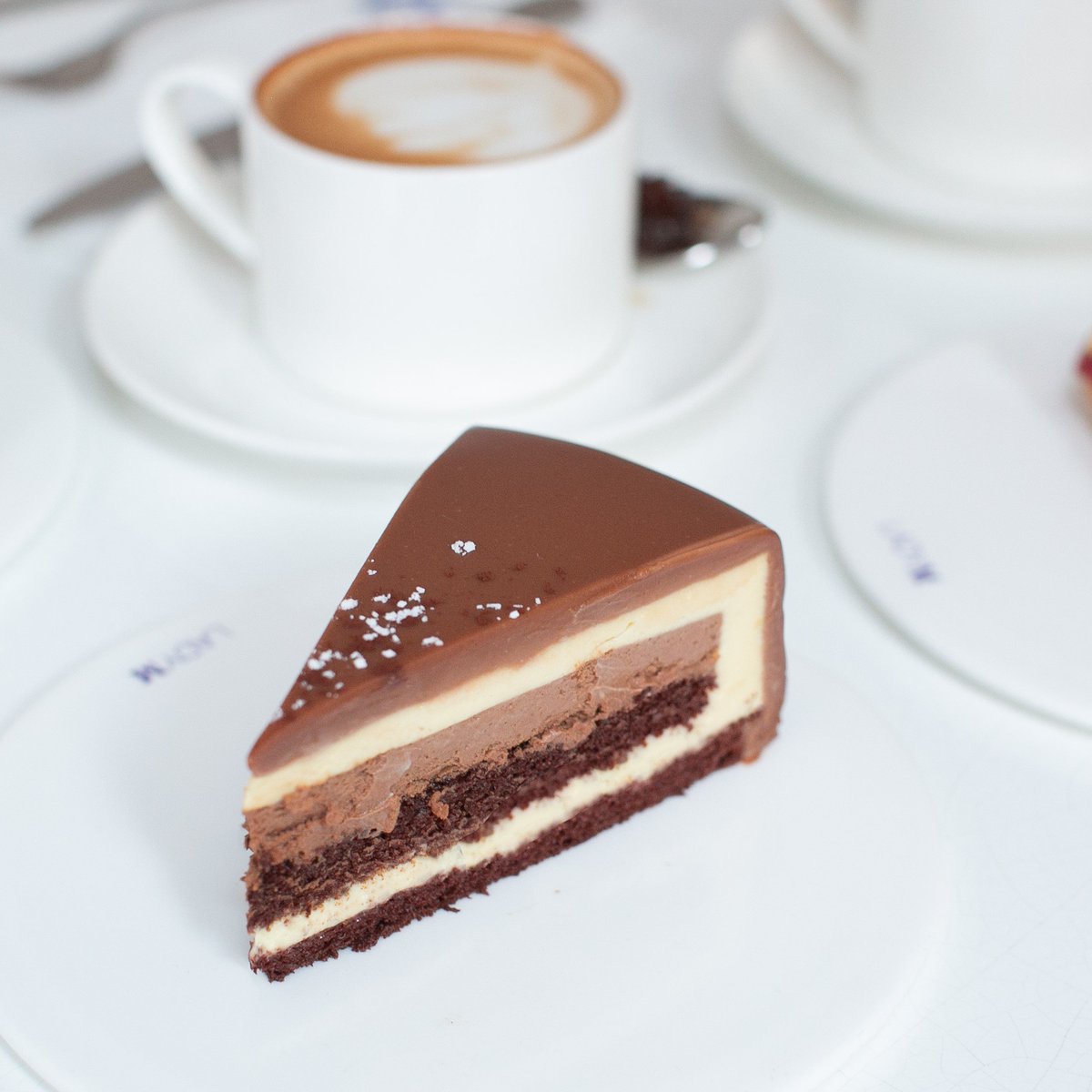 ladymcakes's tweet photo. Our Coffee Mousse is essentially a coffee break in the form of a cake. Count the layers: frothy coffee mousse, dark and heady chocolate mousse and double layers of a whisky-chocolate sponge cake. It's all enrobed in coffee ganache with dustings of cocoa and snow sugar. https://t.co/dyn02kMV3X