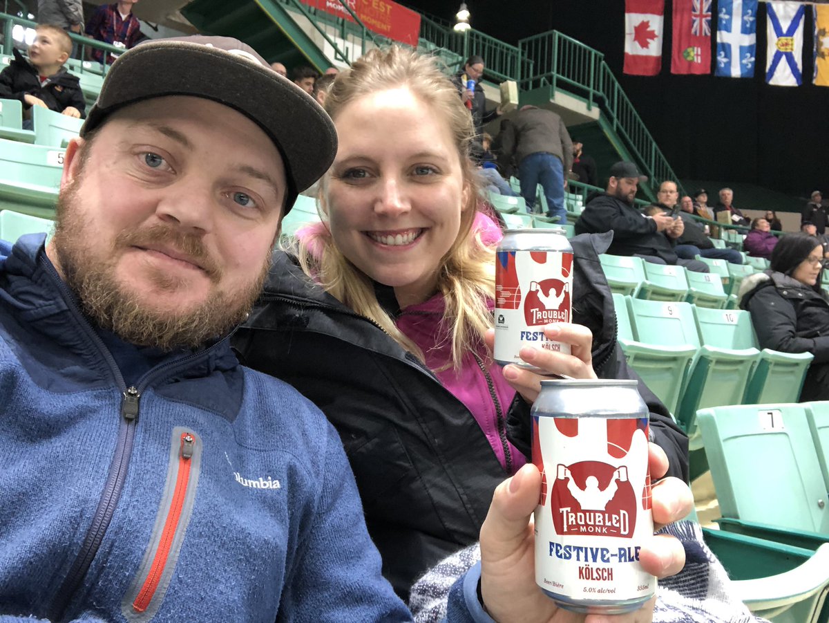 Symesko's tweet photo. Finishing our date day at #GoTeamAB vs #goteamNB men’s hockey. Full @2019CanadaGames mode with the delicious @TroubledMonk festive beer. Back to #volunteer life tomorrow. https://t.co/Z4sd7aZ78a