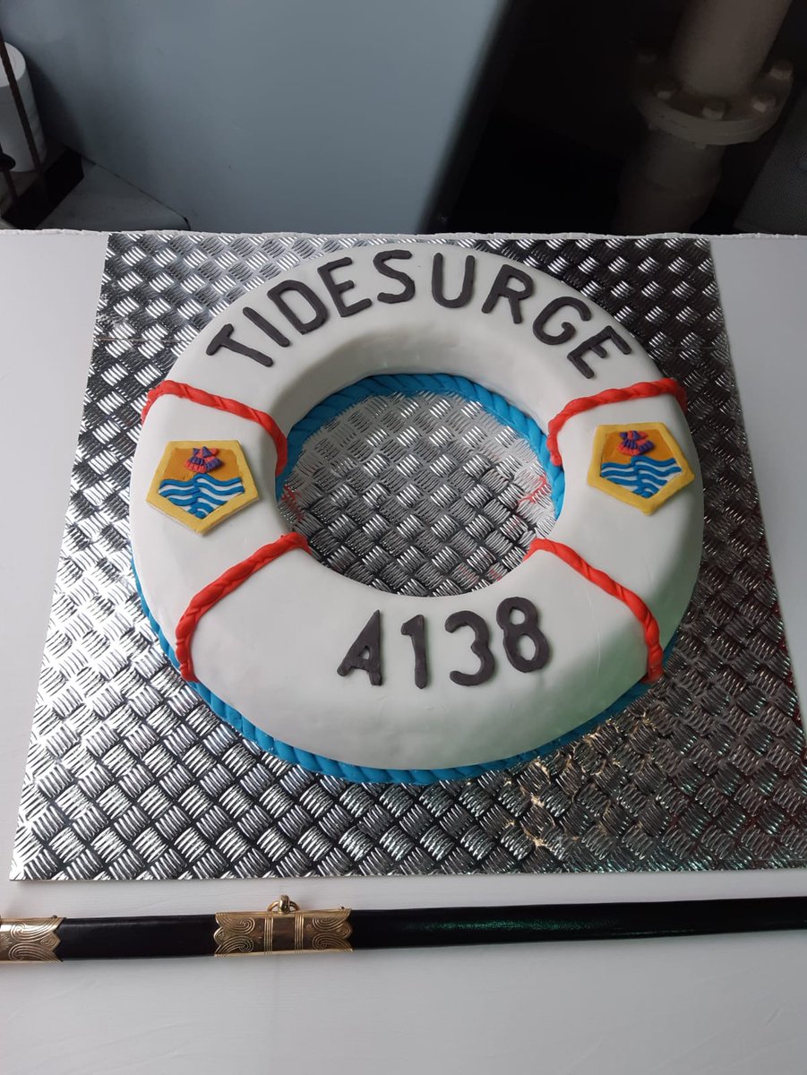 RFATidesurge's tweet photo. @RFAHeadquarters Here's a photo of the service of dedication cake, when it was still in one piece! A splendid job by the catering personnel on board - particular recognition goes to our leading hand for the fantastic design. #cake #yum #ServiceOfDedication https://t.co/lZPpmqkmBe