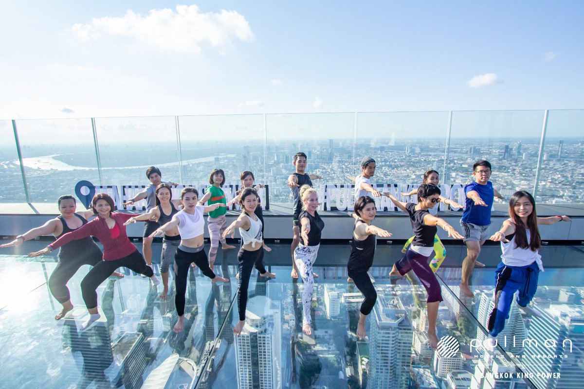 PullmanBangkok's tweet photo. The very first time in Thailand a special yoga class was held 314 meters high up in the sky above Bangkok! at #MahanakhonSkywalk
#UpYourGame by Sarah Hoey, the Pullman Wellness Coach, and Thai professional yoga instructor Pop Areeya.
#PullmanWellbeing https://t.co/ATBIwX6y4D https://t.co/kCe2OZIKUP