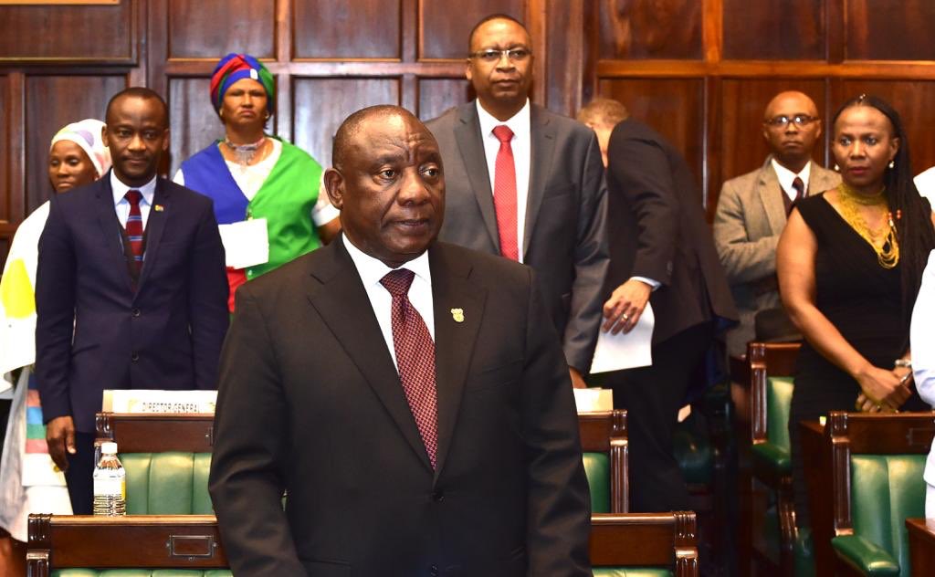 PresidencyZA's tweet photo. President @CyrilRamaphosa arrives at the Old Assembly Chamber in Parliament for the debate on the National House of Traditional Leaders address he delivered to the House on Tuesday, President Ramaphosa is received by @NationalCoGTA Dr Zweli Mkhize. #NHTLDebate https://t.co/XjF4un8dHB