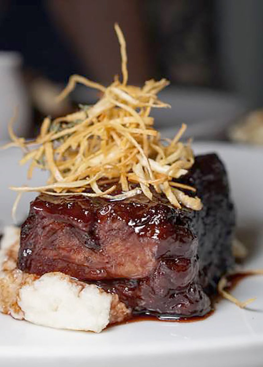 Tuck into our “fall apart” 12-ounce Brandt Beef Short Rib with white grits, chanterelle and gouda fondue – one of our signature winter dishes. 

#Delicious capture by <a href="/befatbehappy/">Caitlin Sak</a>