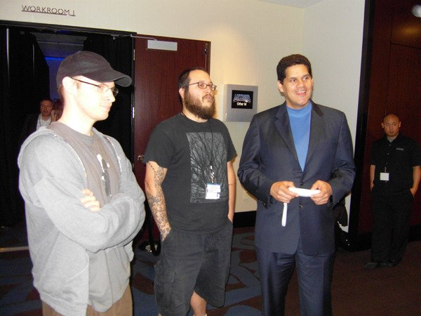 SuperMeatBoy's tweet photo. Here's a picture of Reggie playing Super Meat Boy on Wii. He said "I'm buying this with my own Wii points, I'm serious guys". Pretty sure he ended up with it on WiiU and Switch. Happy retirement my dude! @NintendoAmerica https://t.co/O3DaAc0WuY