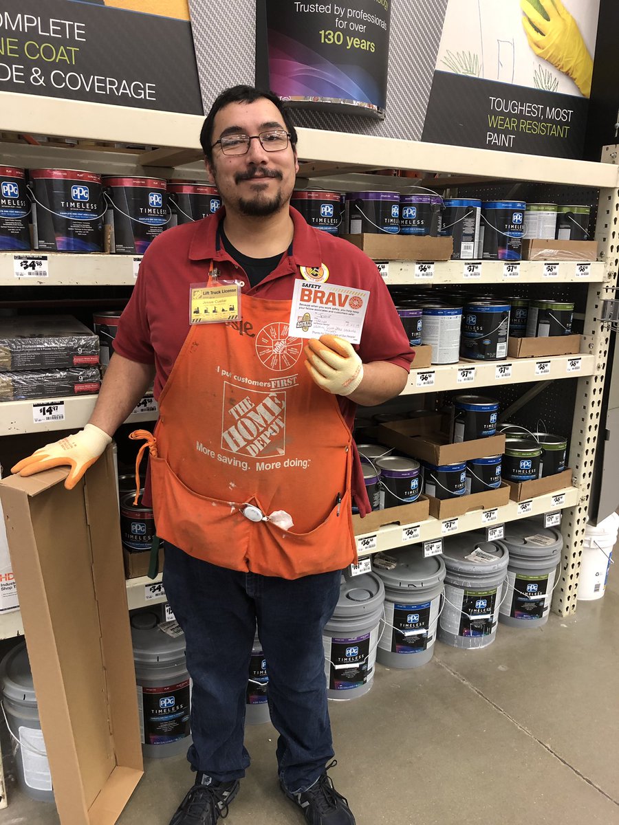 Jessie wearing his gloves while stocking shelves in Paint Dept supporting #whyiworksafe! #OrangePromise #6514HomeDepot #SafetyMatters