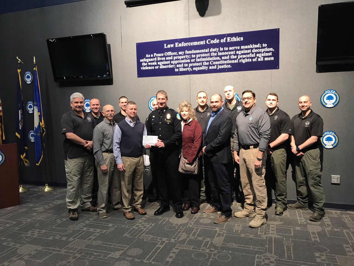 Etownpd's tweet photo. The amazing folks with the Etown Police Foundation presented us with a check for $10,000 today to purchase headsets for our S.R. Team! https://t.co/QngNzYP6hM