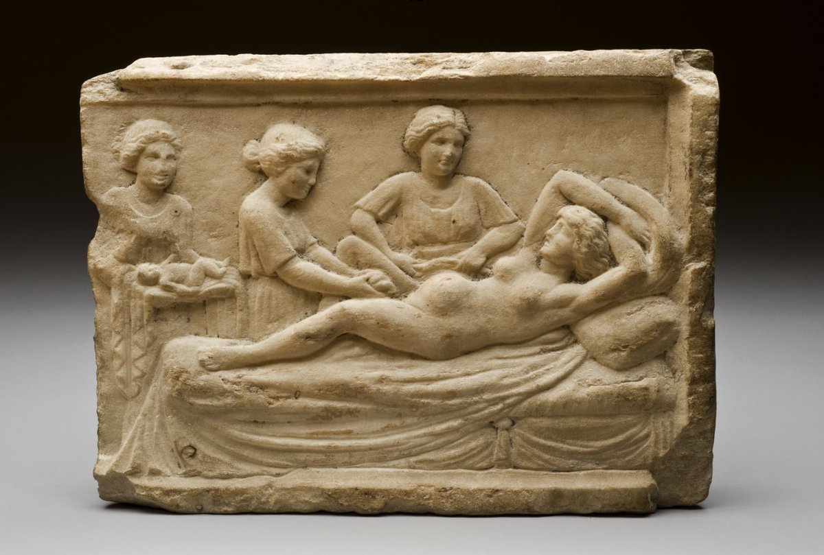 Roman funerary relief from #Ostia with a parturition scene. A woman is lying on a bed, giving birth to two or perhaps three children. She is assisted by three women. #Rome, #Italy.