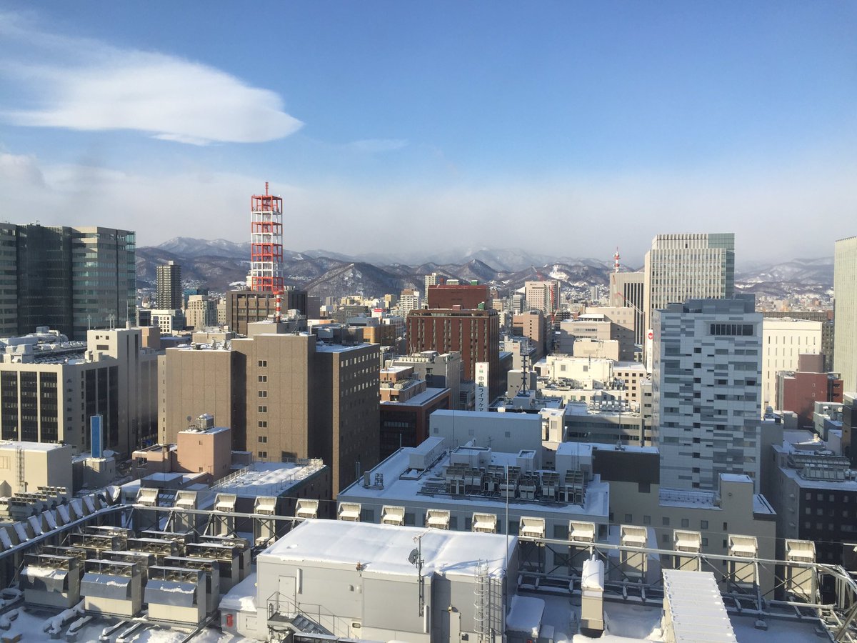 TomDoesTravel's tweet photo. Woke up to blue skies over Sapporo and the snow-dusted mountains of Hokkaidō #Sapporo #LPinJapan #ResilientJapan https://t.co/qK2ZxfZAuq