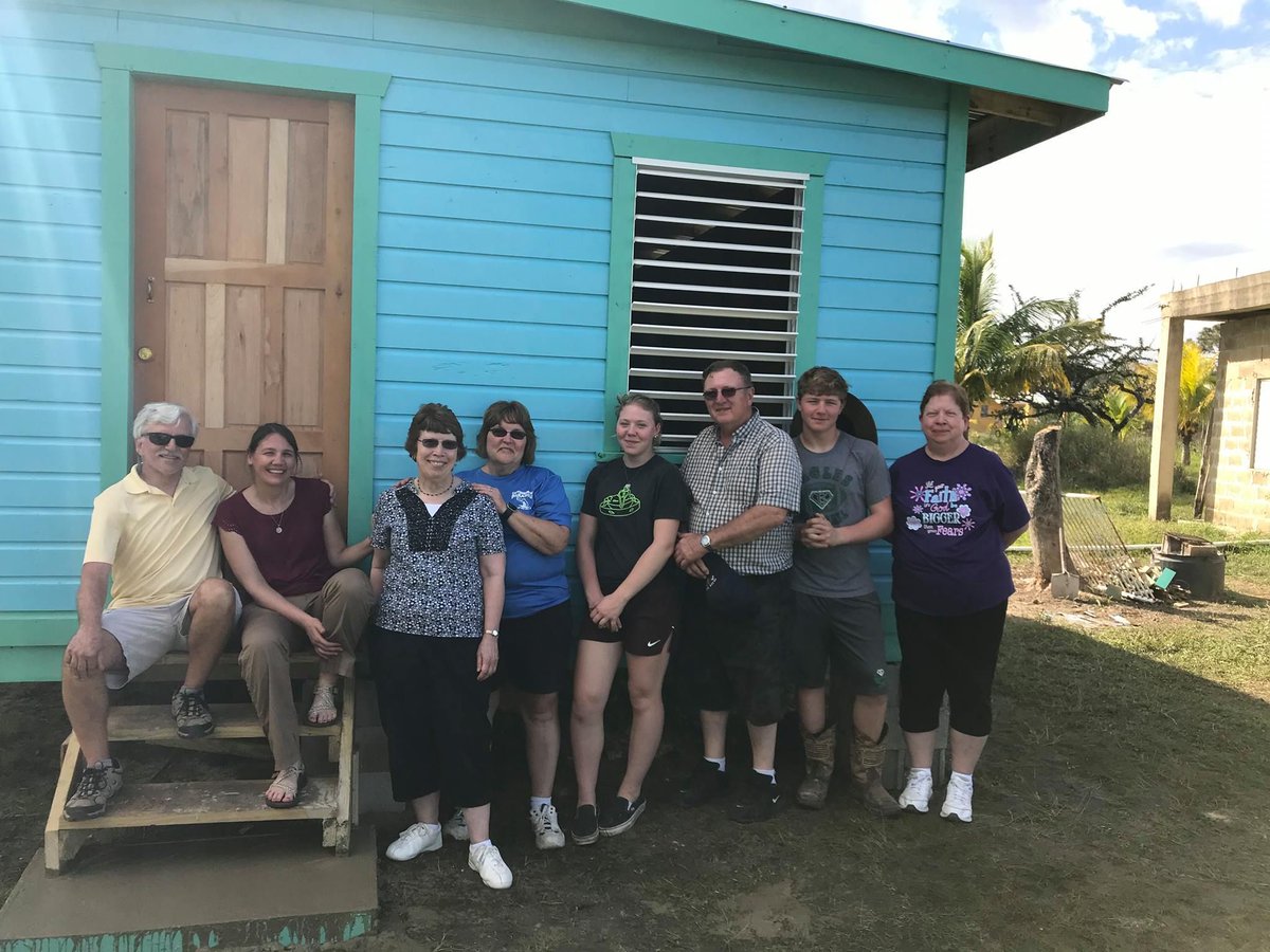 SCN_Volunteers's tweet photo. This volunteer group, led by Sister Chris (2nd from left), completed a home in Belize in memory of Andrew Reed. The late Mr. Reed’s parents and children (right), worked this past week to help a family in need. https://t.co/PdFdm5L4el