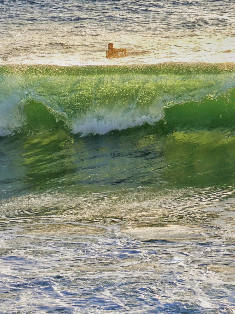 Lone surfer waiting to catch the best wave at Porthleven pier #surfer #waves #porthleven #cornwall #lovecornwall #kernow