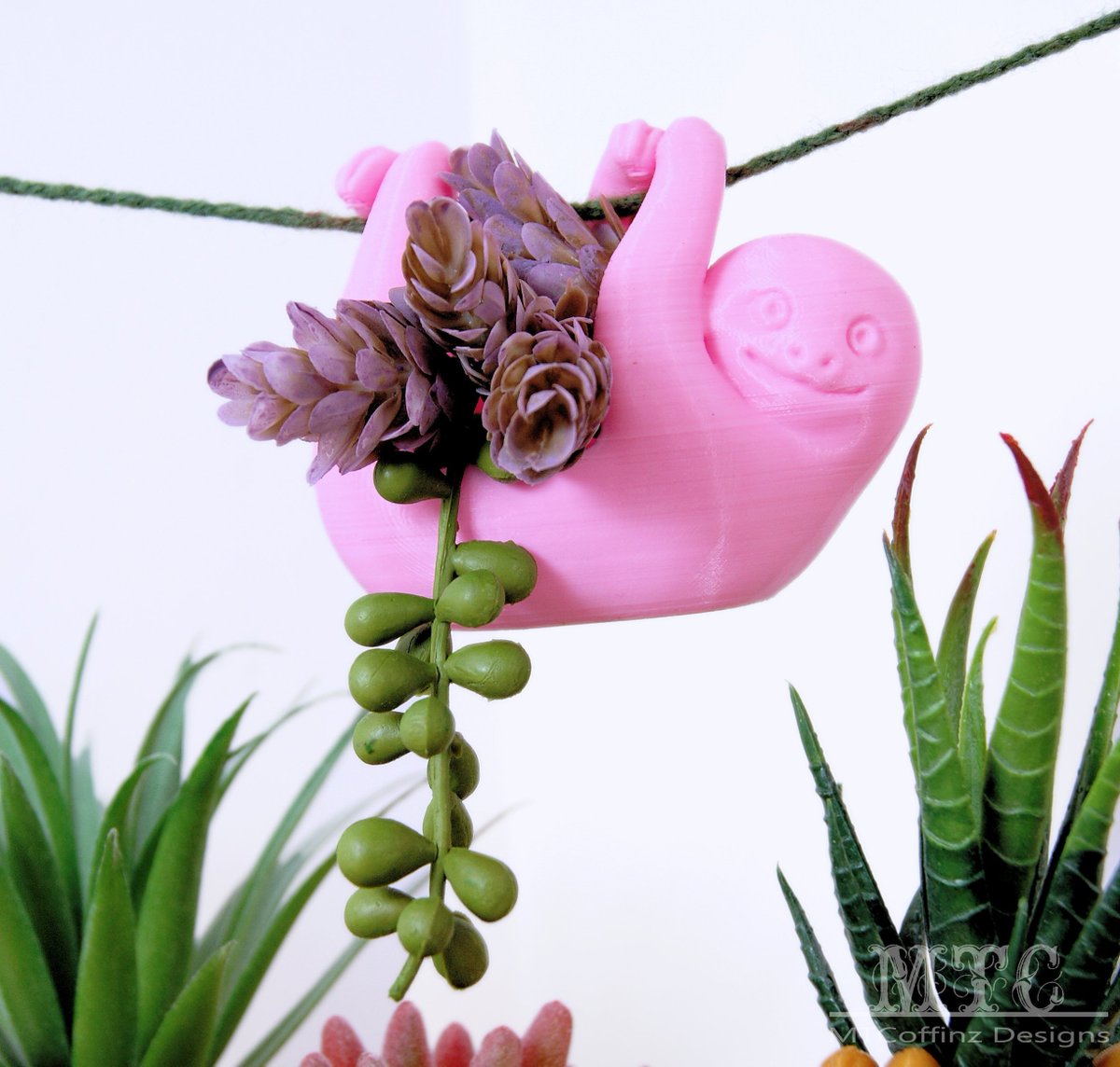 MTcoffinz's tweet photo. Baby Sloth doo doo doo doo doo doo.  3D printed Succulent planter. #MTcoffinz https://t.co/oGRyDzx2hE https://t.co/4YWD6bu54S
