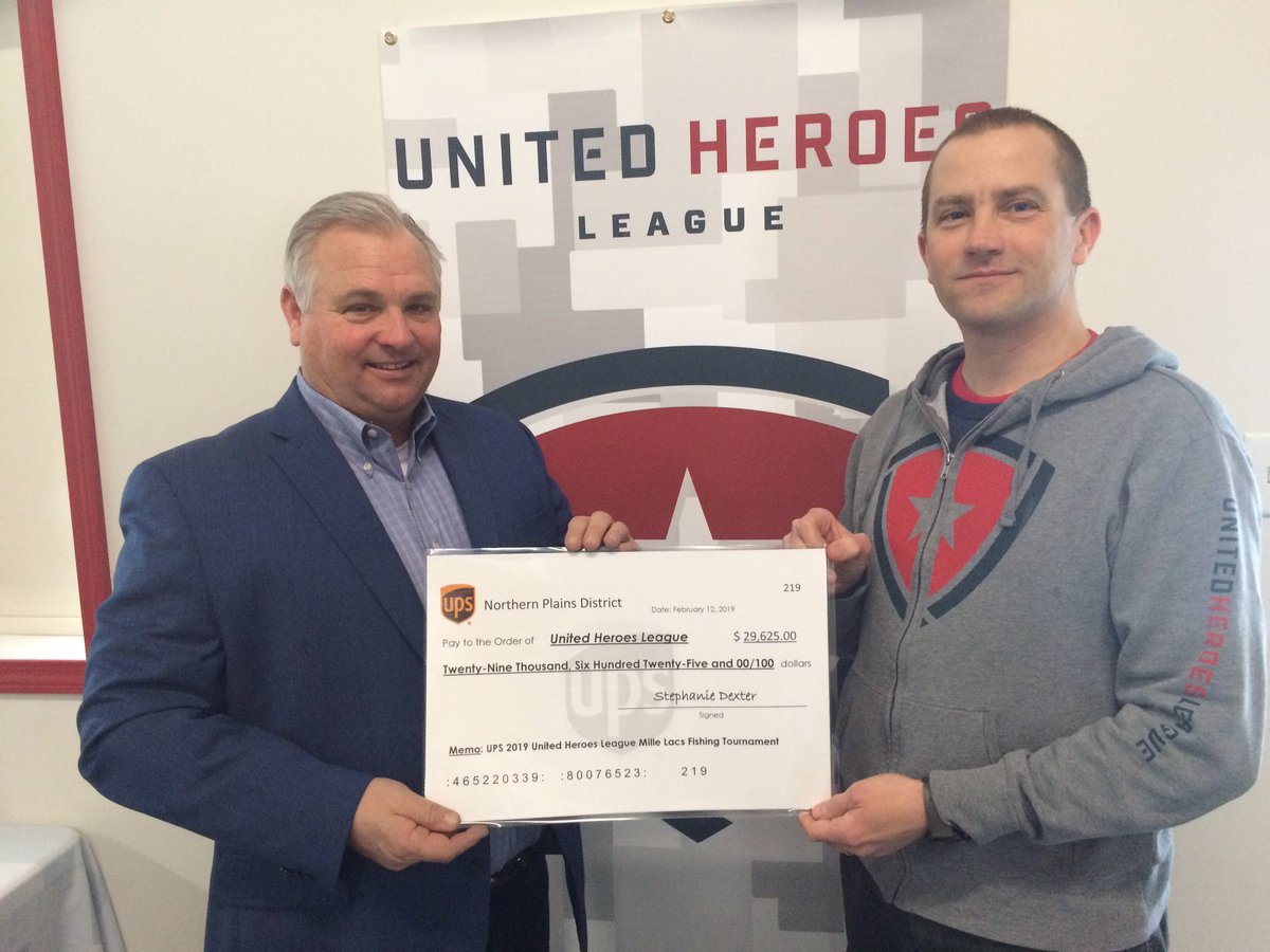 Jay Lorek Presenting Shane Hudella from UHL with$29,652 raised at this years Ice Fishing tournament #SuperUPSers