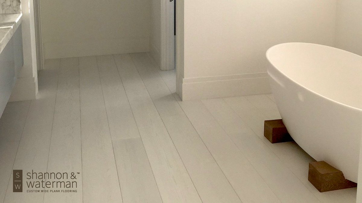 If you're considering hardwood floors in your bathroom, a marine-grade finish is a great choice and provides a fully waterproof seal that is most preferred. #swwideplank shannonwaterman.com