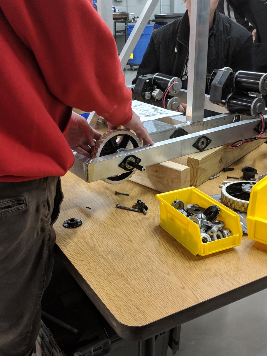 Alec working on putting  the wheel onto the drive train