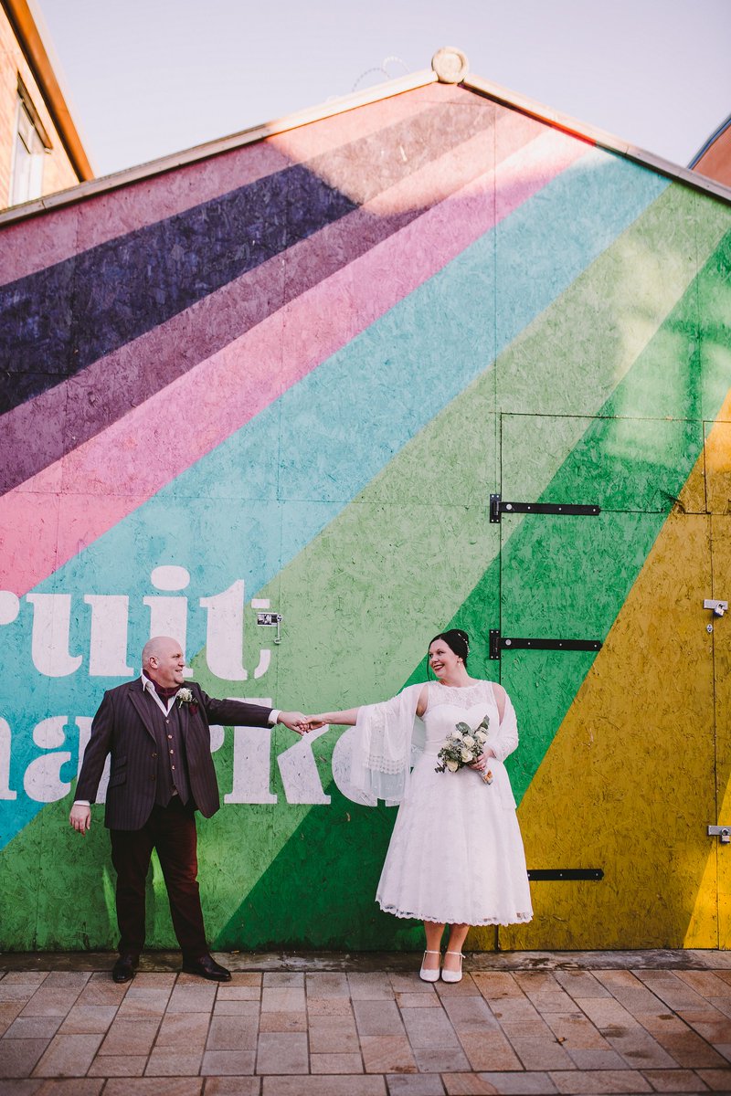 FruitMarketHull's tweet photo. We adore this picture of newlyweds Katy and Simon Stevens by the #FruitMarketHull rainbow wall. ❤️ 💛 💚 💙 💜 Congrats guys! #Valentines #LoveFruitMarketHull 📷 by Ginger Snaps Photography https://t.co/qwaNu9WRRg