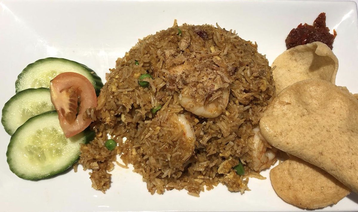 A photo sent in from a happy customer who dined with us last week. This is our Nasi Goreng, which is a Malaysian style wok-fried rice with sambal and soy sauce. You can choose between chicken or prawn for this dish, which would you go for? 🍤