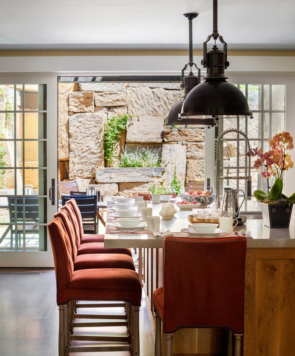 ForumPhi's tweet photo. An open flow between indoor and outdoor spaces creates an atmosphere for socialization, like in this gorgeous mountain home. The rustic orange tones complement the exterior furniture seen through  large glass sliding doors. Reach out today to update your space. #ForumPhi https://t.co/qh0RtVrSSs