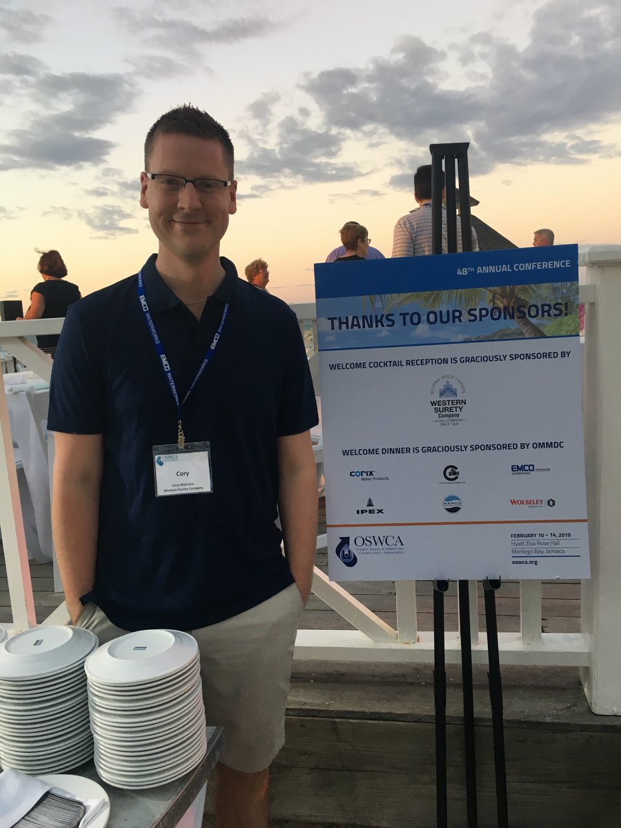 WesternSurety's tweet photo. It’s a tough job, but someone’s gotta do it! Cory Manchur is attending the Ontario Sewer &amp; Watermain Construction Association Conference being held in Montego Bay, Jamaica. We were proud to sponsor the Welcome Cocktail Reception, mon! #MBJ #Jamaica #Conference #OSWCA https://t.co/yvm2XXfeBq