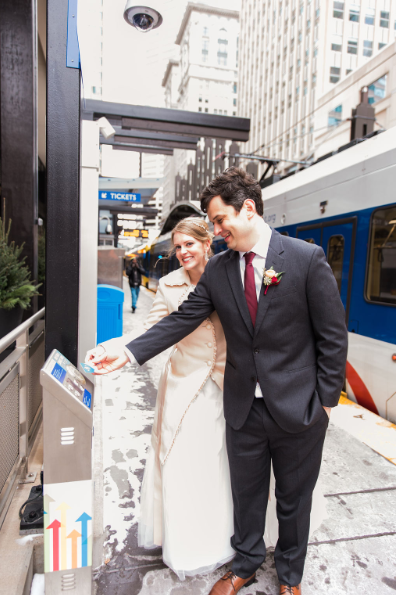 MetroTransitMN's tweet photo. Metro Transit planner Sonja Burseth and her husband Chris demonstrated their shared love of transit when they got hitched in Minneapolis late last year. After exchanging vows, the couple took photos on the Blue Line and at light rail stations. Happy #ValentinesDay all! ❤️ https://t.co/xFo0Bj0UJP