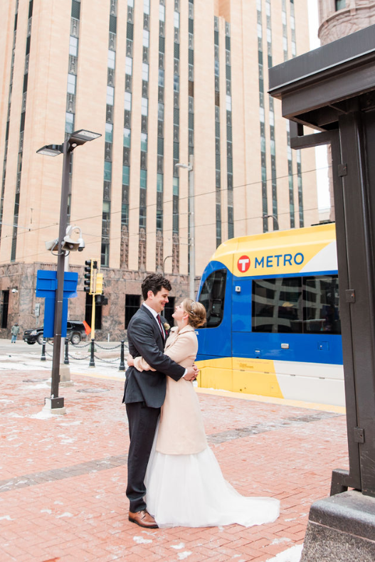 MetroTransitMN's tweet photo. Metro Transit planner Sonja Burseth and her husband Chris demonstrated their shared love of transit when they got hitched in Minneapolis late last year. After exchanging vows, the couple took photos on the Blue Line and at light rail stations. Happy #ValentinesDay all! ❤️ https://t.co/xFo0Bj0UJP