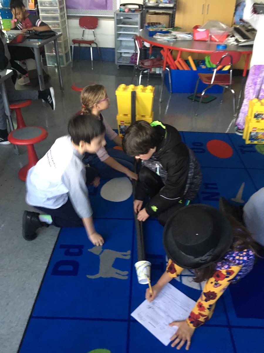 Garfield grade 4 science students investigate how hills give roller coasters energy by experimenting with a model “bumper coaster”. Serious fun!