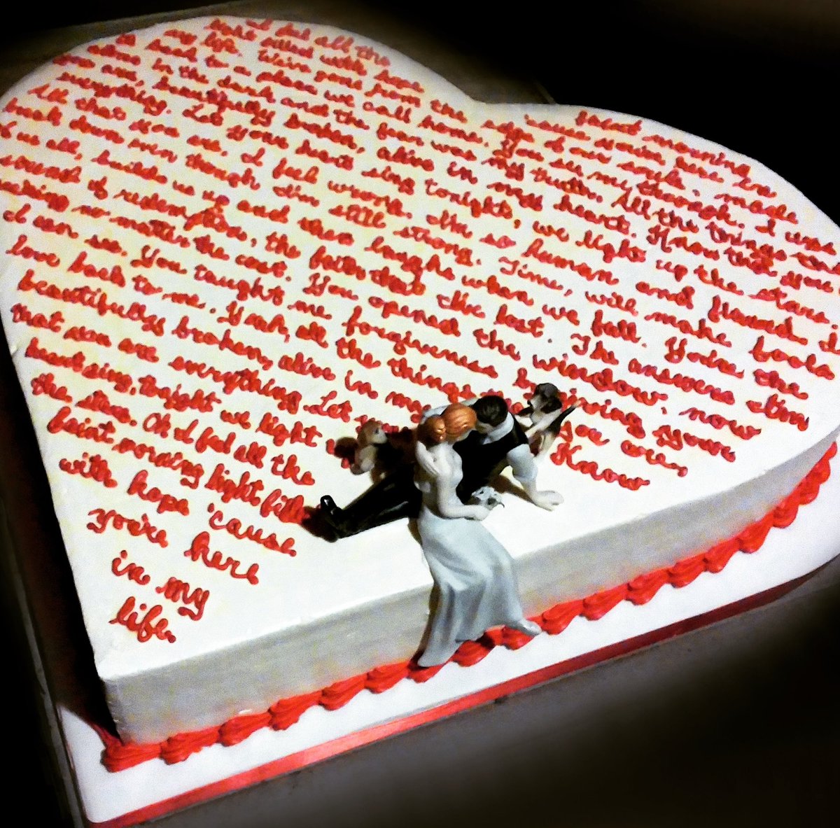 kates_kakes's tweet photo. We are in the business of #love ! #weddings, #anniversaries, #birthdays, etc. But one of our all-time favorite love #Kakes is Kathie and Kevin's #weddingcake, a #heartshaped cake decorated with the words to their song. 
#happyvalentinesday #kateskakesny #kateskakes https://t.co/XbojnWEzWt