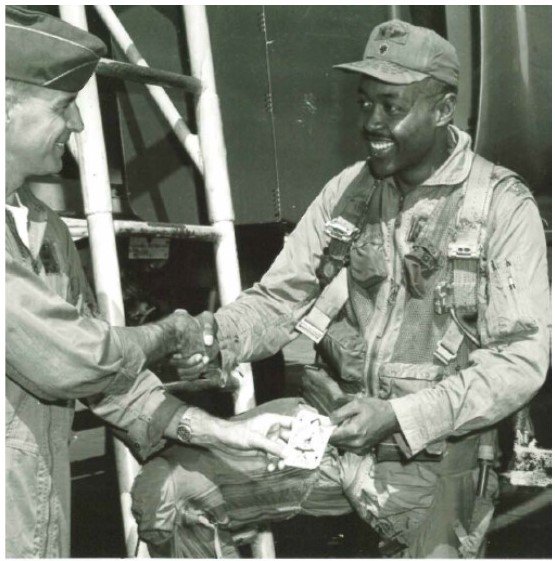 Air Force F-4 pilot Major J. Timothy Boddie, Jr. receives a patch for his 200th combat mission, including 57 missions over North Vietnam, in summer 1967. (Courtesy of Brigadier General [Retired] James Timothy Boddie, Jr.) #BlackHistoryMonth #VietnamVeteran