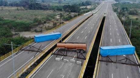 CBCWorldNews's tweet photo. How a bridge between Colombia and Venezuela become part of a propaganda fight https://t.co/ylfcs4h9cu https://t.co/JmHw90ikK4