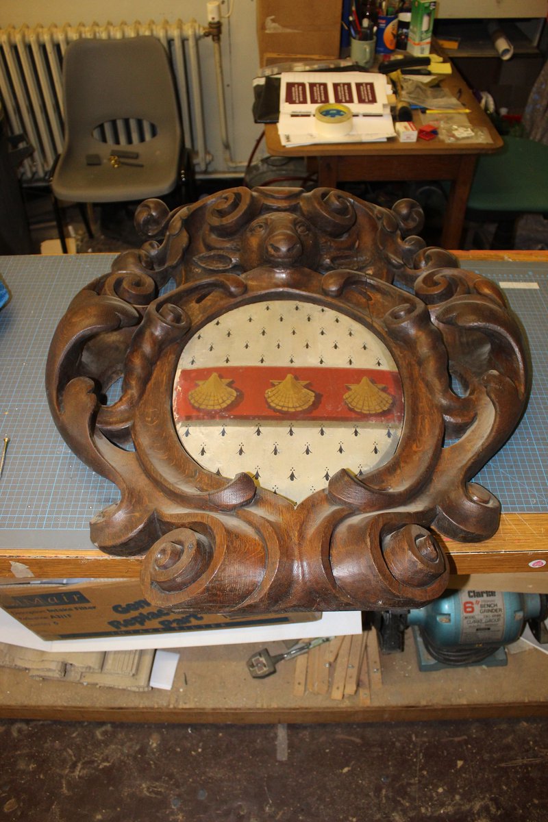 AskaConservator's tweet photo. Temporary removal of a carved armorial shield mounted high near Great Hall @TempleNewsam out of harm's way while some wiring work is done.....close inspection, some lifting paint to attend to, with Lascaux acrylic polymer. https://t.co/x5siH7koIz