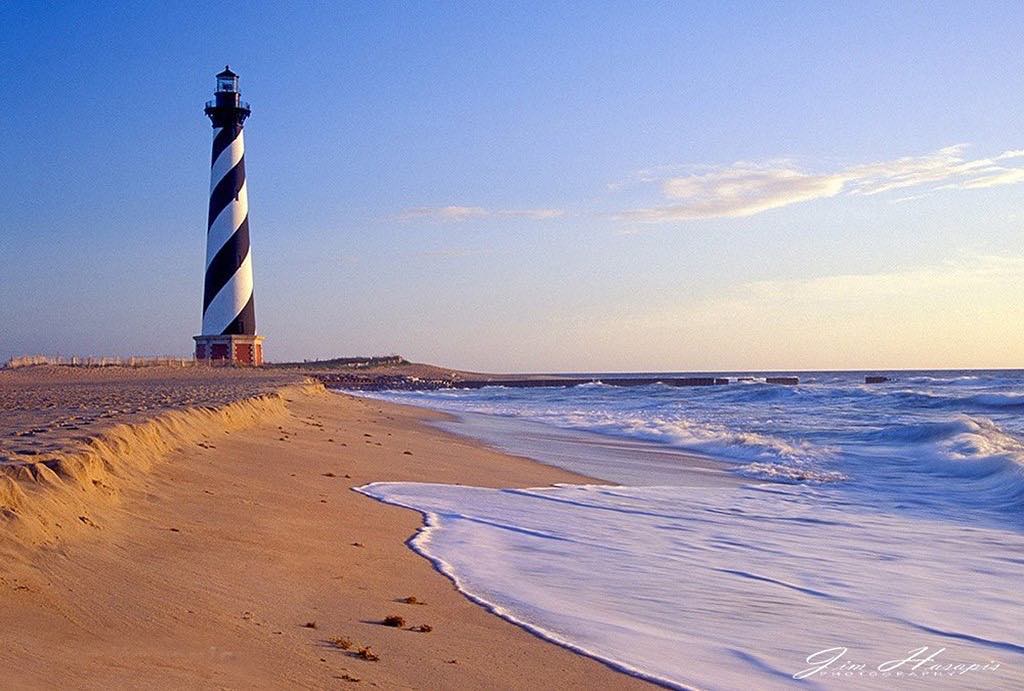 NCTourismLLC's tweet photo. Cape Hatteras Lighthouse before it was moved during the 1990's. (photo: @jim_hasapis_photography) #repost #capehatteras #nctourism #ncvisit #nctravel #ncvacation #capehatteraslighthouse #outerbanks #obx #waves #beach #saltlife https://t.co/yZxHlqMAjP