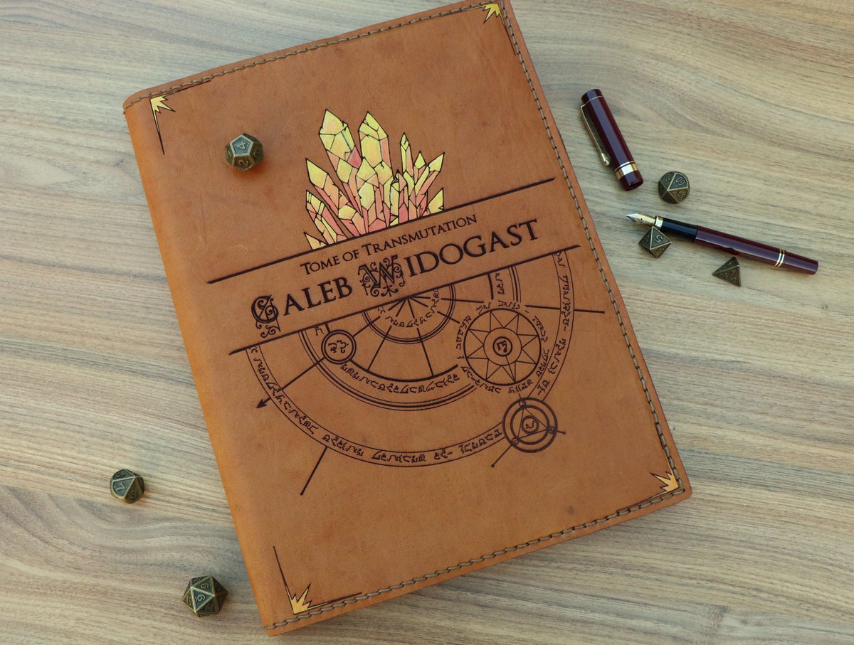 CeryneianA's tweet photo. It took me a week to finish this thanks to a severe cold and some odd-jobs for Valentine's day but my leather spellbook cover for Caleb is finally done! Look at my pretty Player's Handbook! Or maybe for #VoiceOfOBrien? 🌟#criticalrolefanart #gildedarchive #CriticalRole #DnD https://t.co/DgAnX5K8hZ