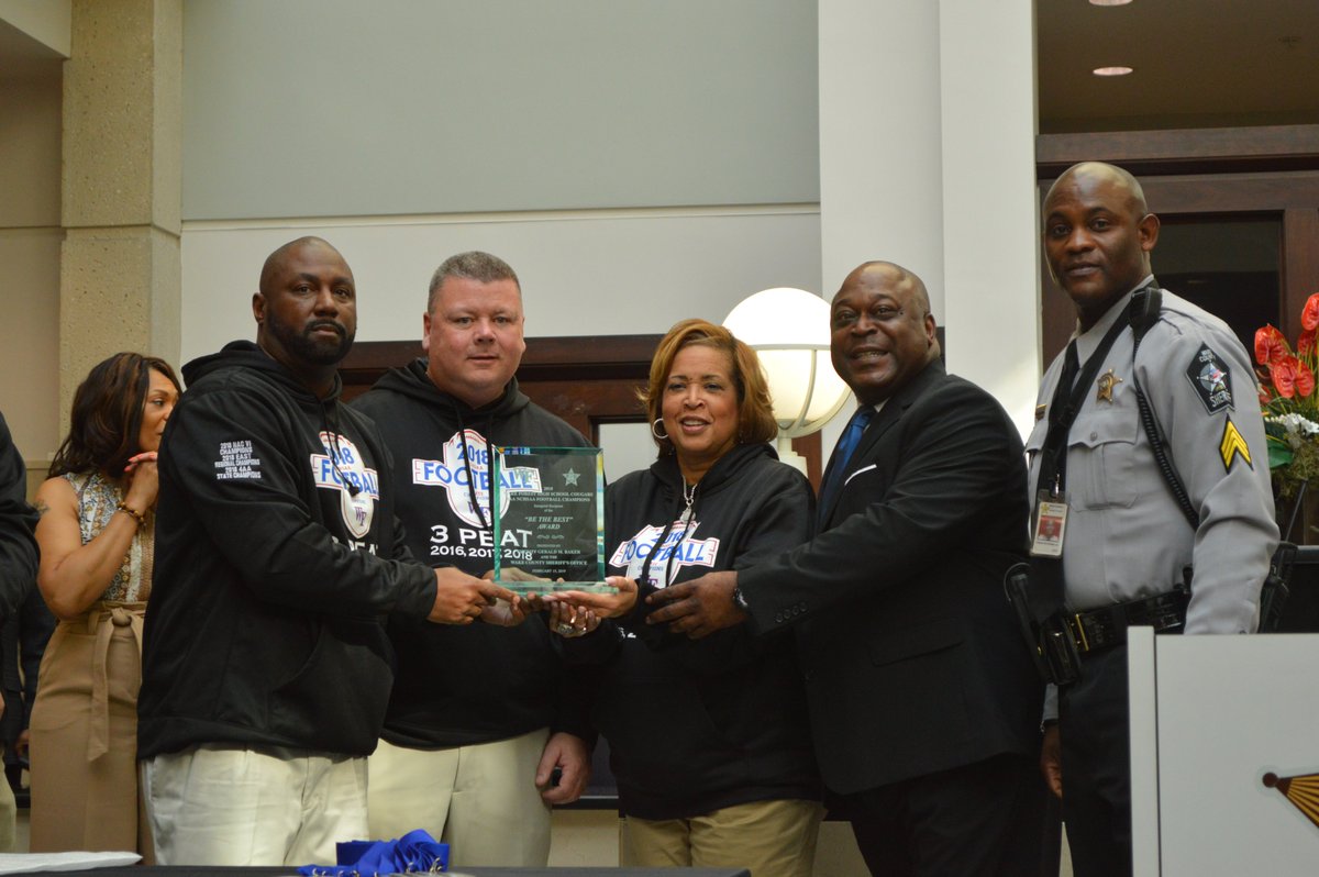 WakeSheriff's tweet photo. It's a joy to have members of the 2018 Wake Forest High School Football Team at the WCSO this morning. The team, who "three-peated" as the state's 4AA NCHSAA Champions in December, received the first annual "Be the Best" award, presented by Sheriff Baker. #WakeProud https://t.co/Cj9ajcybLY