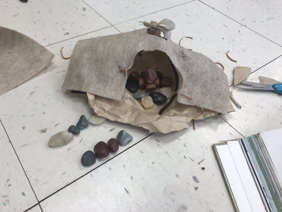 We made wigwams! Woodland Indians used saplings, bark, and vines. Ours were made from pipe cleaners, felt, and rubber bands! It was a challenging task for our young designers. They learned how much work went into building these homes using raw materials.