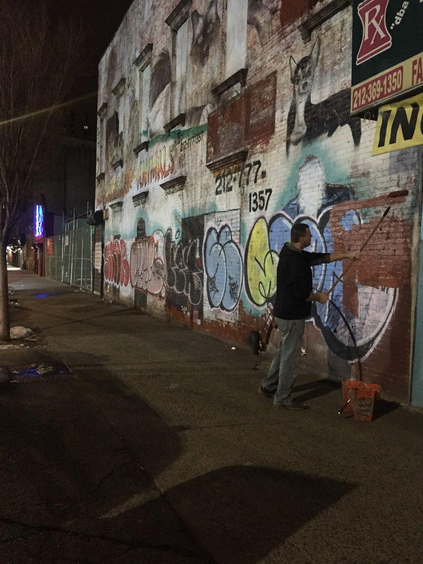 NYPD23Pct's tweet photo. After all the stores are closed and we're safely tucked in our beds, Detective Ross walks the streets of East Harlem with his paint and his roller setting things right so that we'll wake up to a beautiful, graffiti free #EastHarlem #ElBarrio. https://t.co/6W39bjILwf