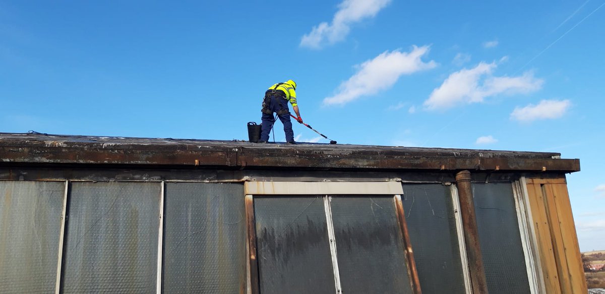 PilgrimChris's tweet photo. A view of me today doing roof repairs on a 60 year old, 24ft high sloping atrium roof which itself is perched upon a 50ft building.
#RatherBeHiking https://t.co/cWVfgroz25