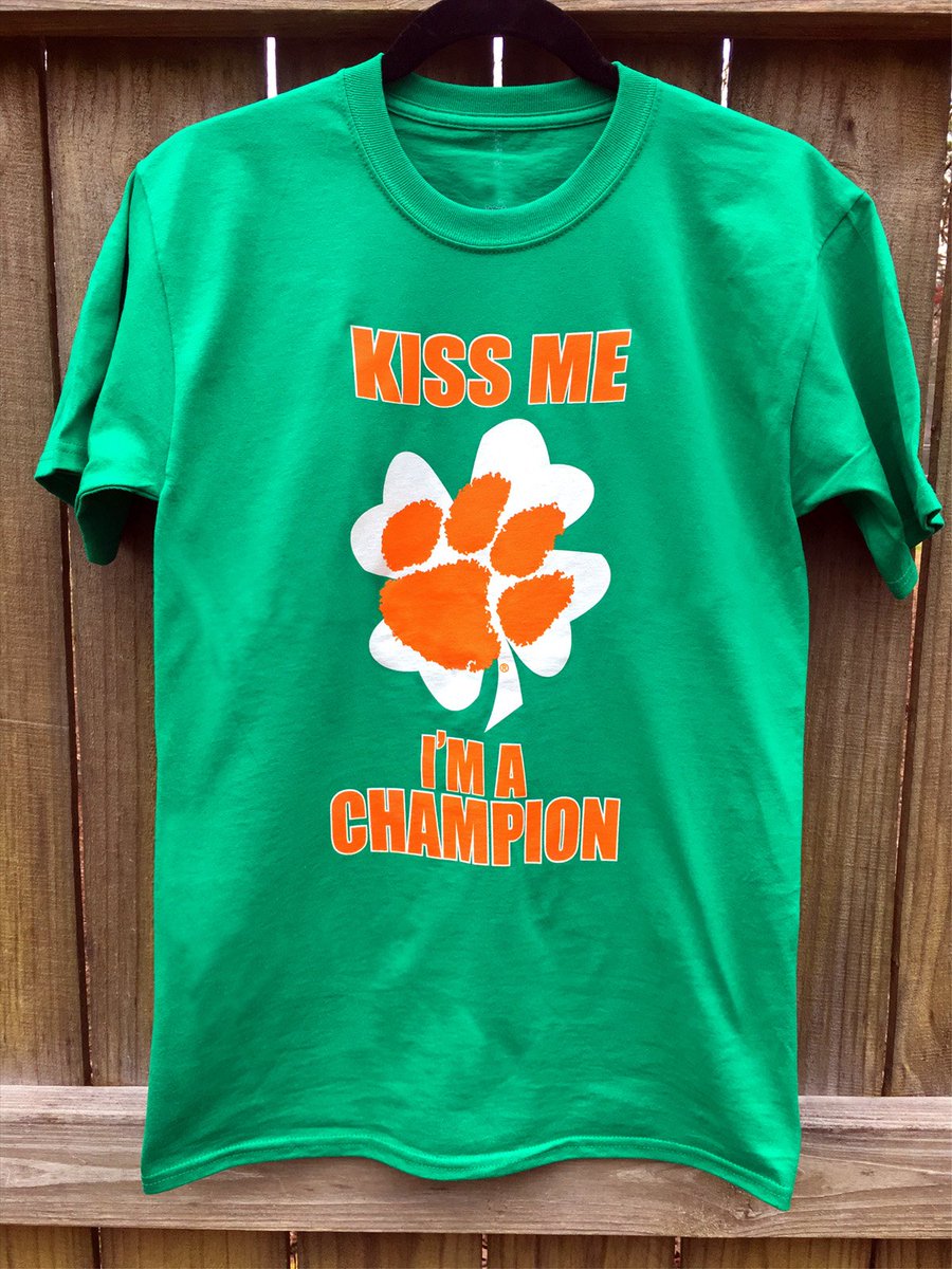 clemsongirl's tweet photo. St. Patrick's Day is one month away. Share the luck of a national champion with our "Kiss Me I'm a Champion" #clemson shirts. Use discount code LUCKY for 10% off. Every purchase gets a free football schedule magnet. #solidorange #solidgreen 🍀🐯🧡 https://t.co/G4a70qGTJF https://t.co/8G2bBZAEei