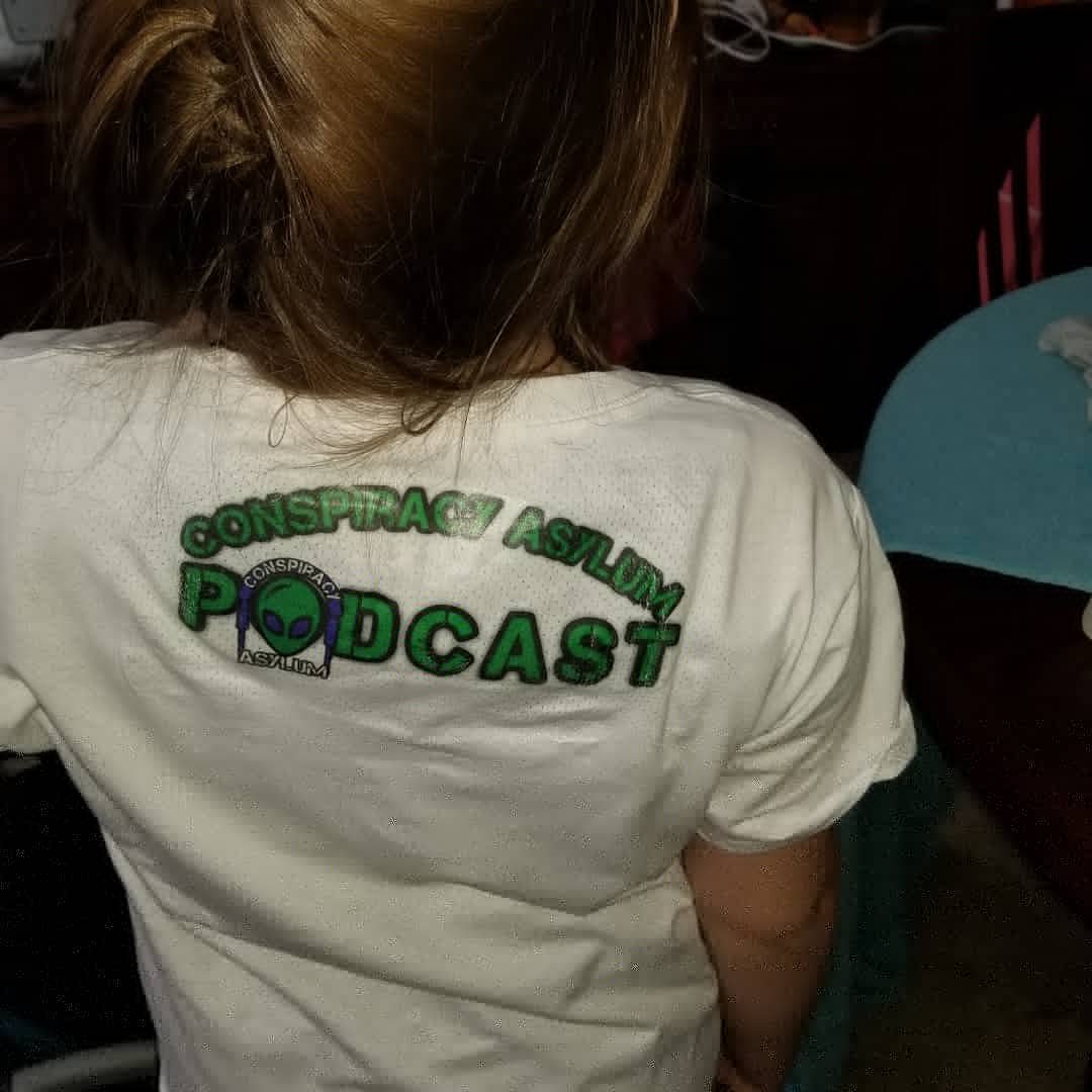 Durpnstein's tweet photo. My beautiful daughter sporting some of the newest Conspiracy Asylum merch The Podcat Tee #podcat #podcast #podcastlife #podfamily #poddad https://t.co/Lja2tFRnkg