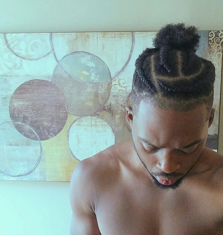 For men who need a new natural hairstyle, this one’s ideal. The cornrows are thick, not too tight, and follow the curve of the skull, and then the ends are gently secured into a top knot puff. #Beautyebooking #HairSalon #SalonSchedulingSoftware #BeautyService  #BeautyAppointments